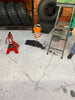 Cracked Concrete with Oil and Paint Spots
