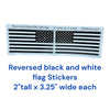 Real Sticky reversed black and white American flag sticker 2-pack, each decal measuring 2 inches tall by 3.25 inches wide, displayed side by side on a retail backing sheet.